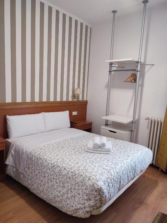Postel nebo postele na pokoji v ubytování Hostal Salomé
