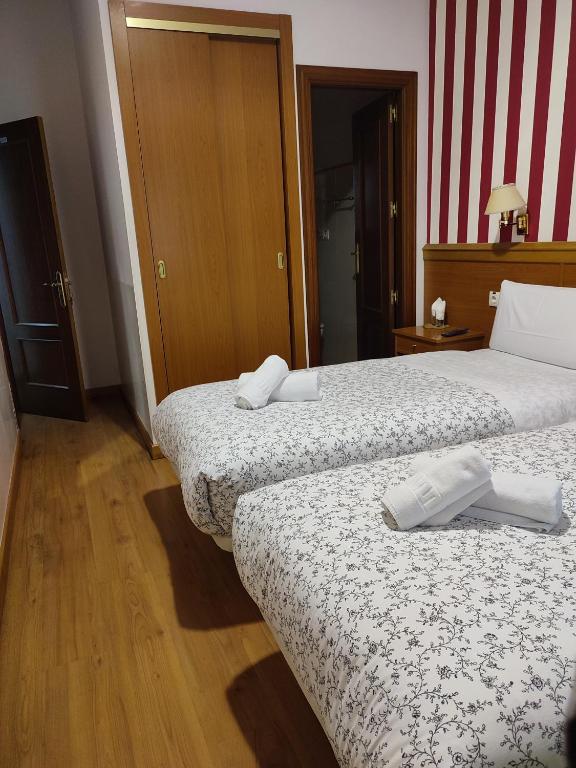 Postel nebo postele na pokoji v ubytování Hostal Salomé