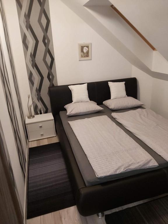 Posteľ alebo postele v izbe v ubytovaní Fodan Apartman