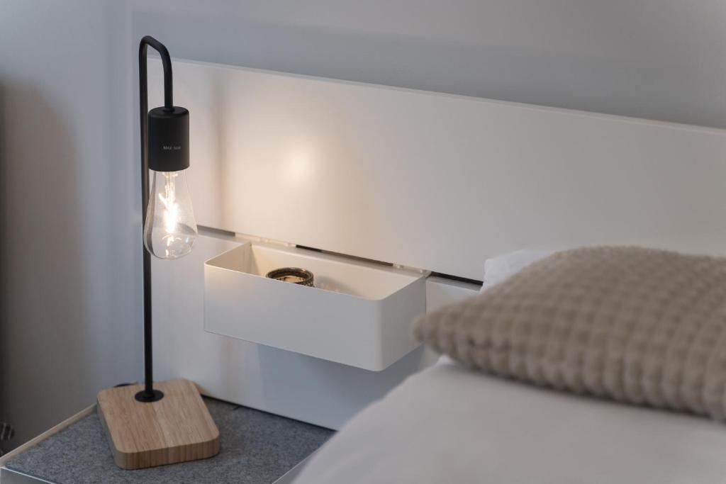 Posteľ alebo postele v izbe v ubytovaní Apartamenty MUNN 3 Szczecin