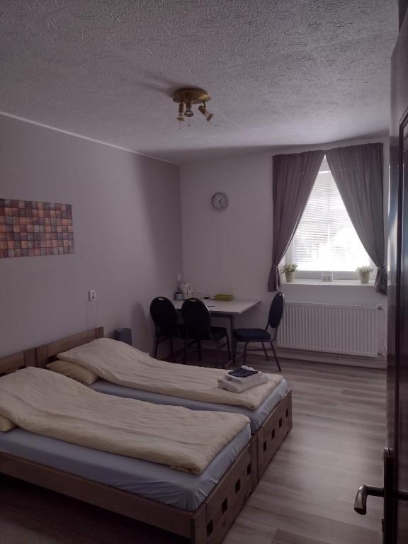 Postel nebo postele na pokoji v ubytování Pension Novy Den