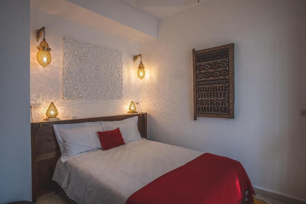 Postel nebo postele na pokoji v ubytování Riad Villa Berna under Swiss Management