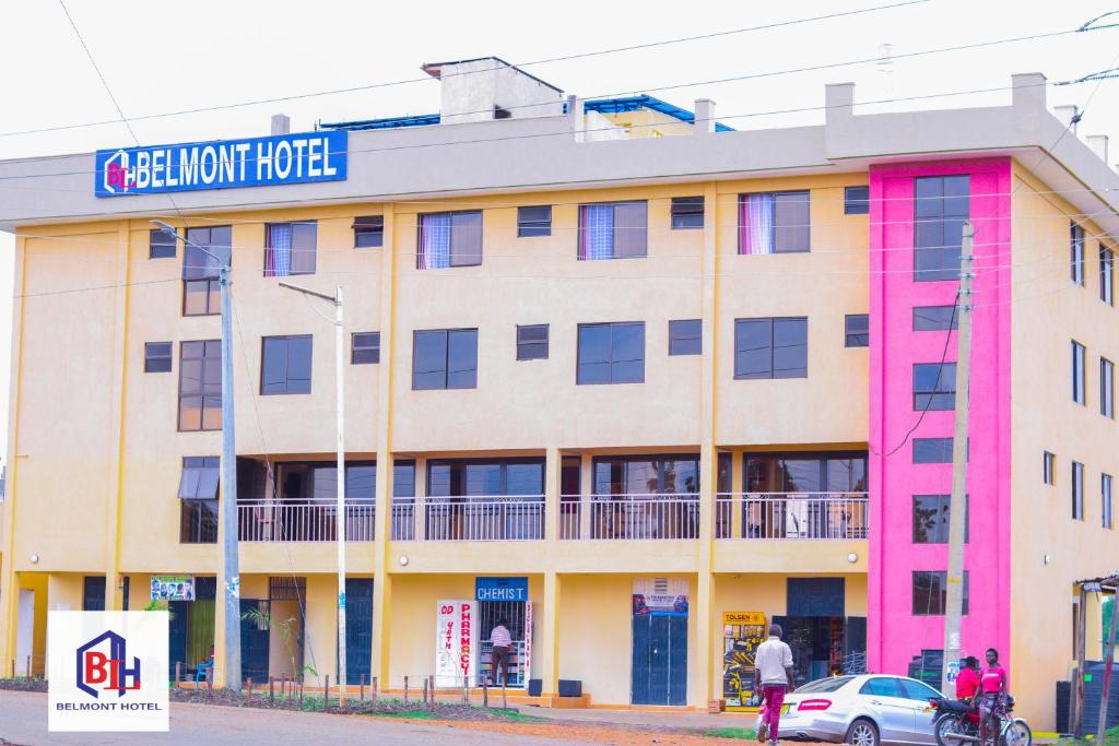 a building with a sign for a hotel at Belmont Hotel Homabay in Homa Bay