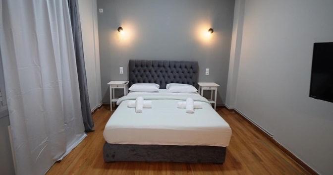 En eller flere senge i et værelse på Athens City Themis13