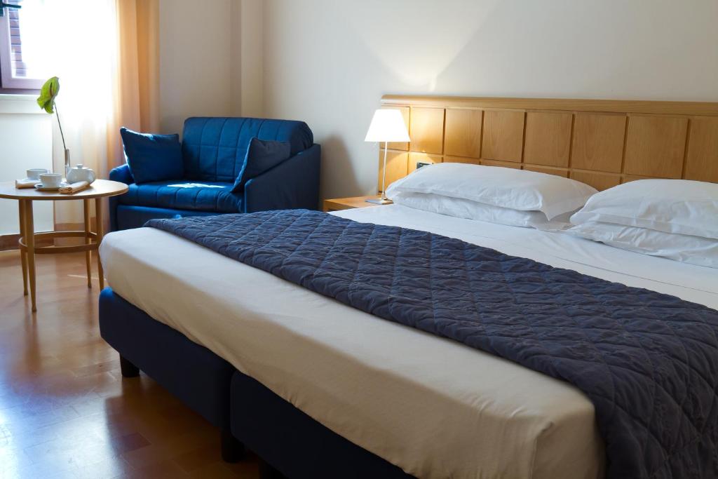 Postel nebo postele na pokoji v ubytování Hotel dei Duchi