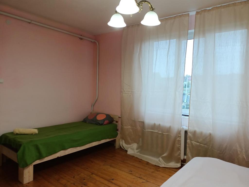 Postel nebo postele na pokoji v ubytování Krone Hostel