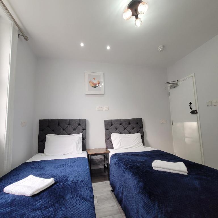 Postel nebo postele na pokoji v ubytování Argyle Square Hotel