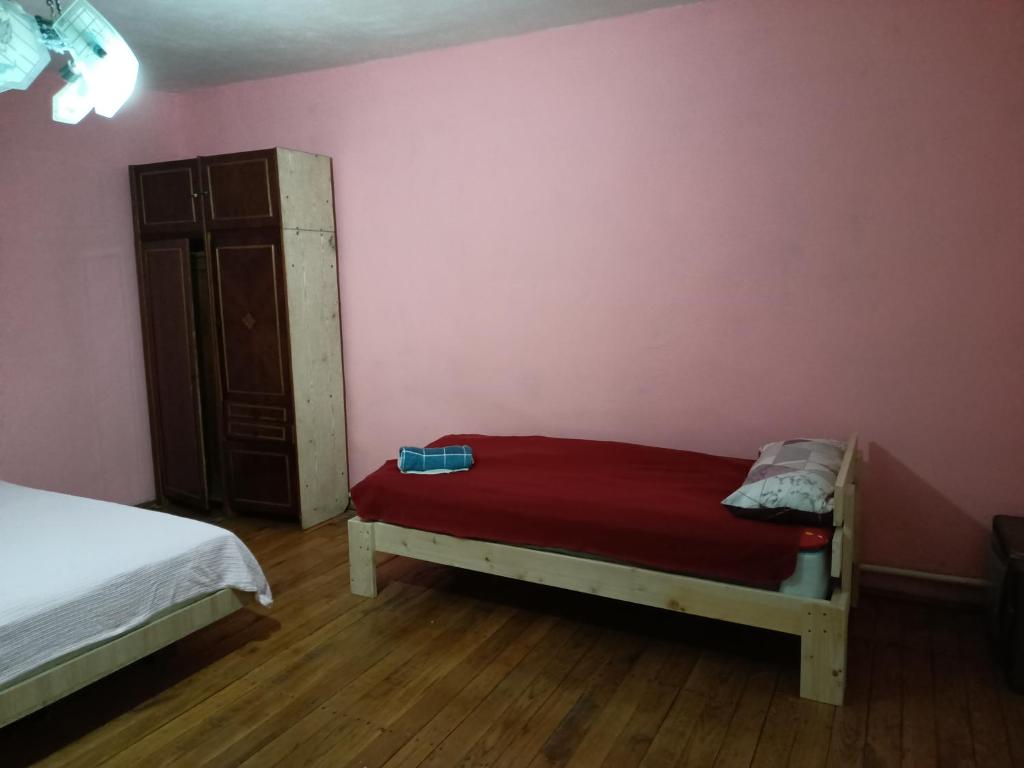 Postel nebo postele na pokoji v ubytování Krone Hostel