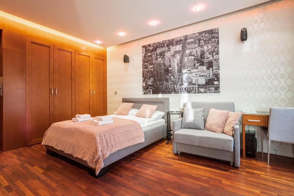 Posteľ alebo postele v izbe v ubytovaní Broadway - Neptun Park by OneApartments