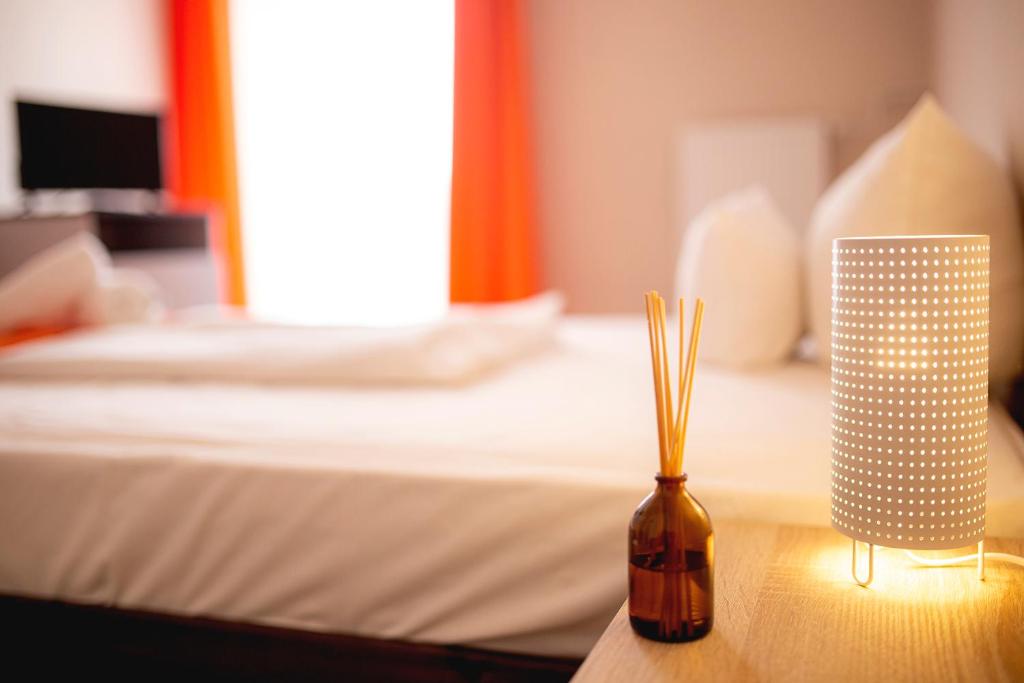 Posteľ alebo postele v izbe v ubytovaní Hotel Kapos
