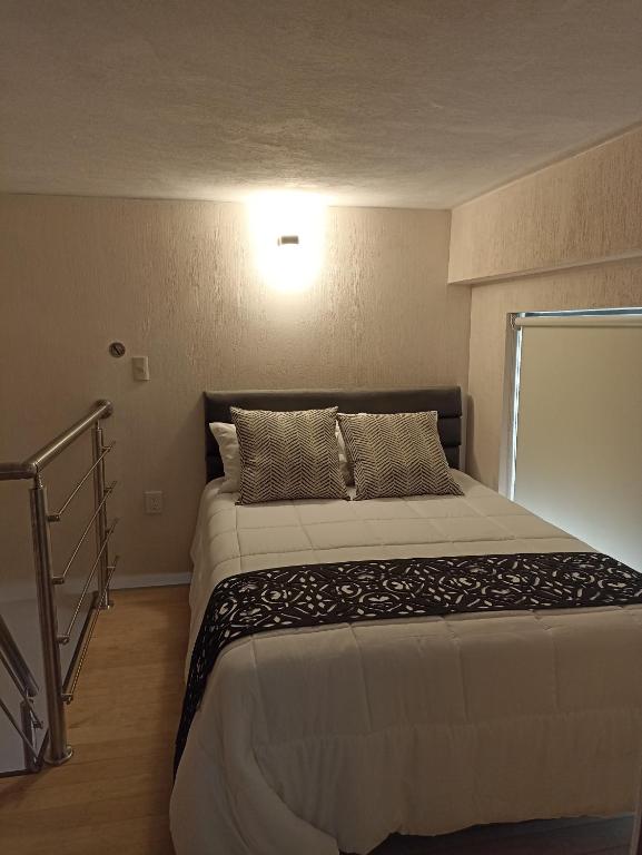 Postel nebo postele na pokoji v ubytování Hotel Del Valle