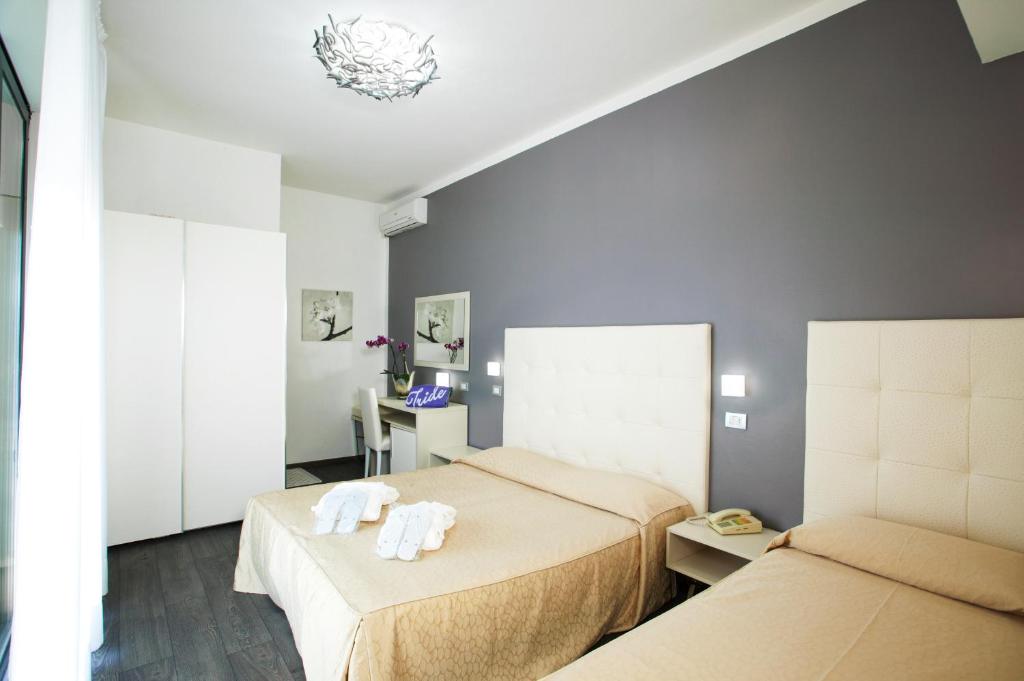 Postel nebo postele na pokoji v ubytování Hotel Iride & Spa
