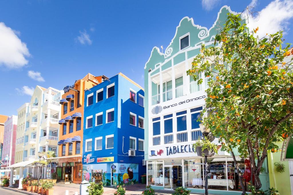 a group of buildings on a city street at World Heritage Apartments in Willemstad