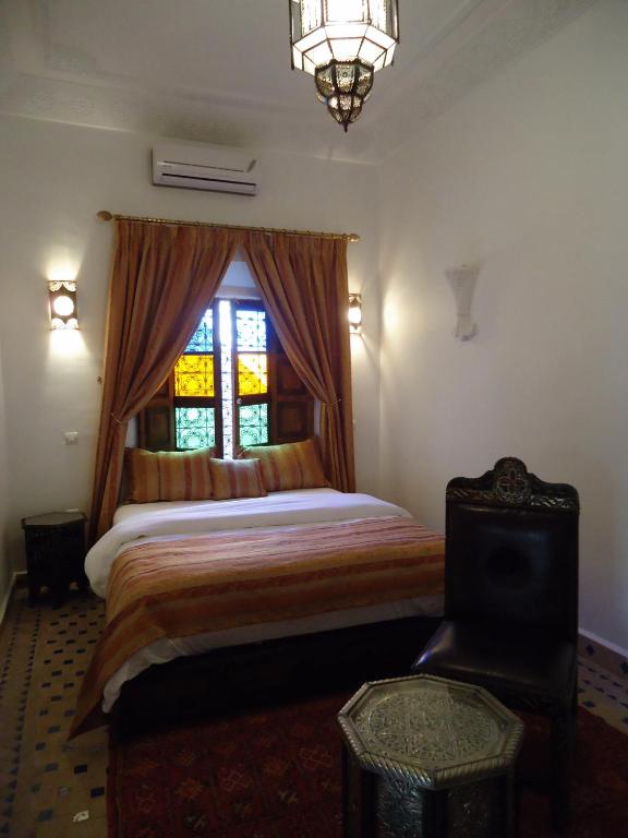 Postel nebo postele na pokoji v ubytování Riad Tahar Oasis