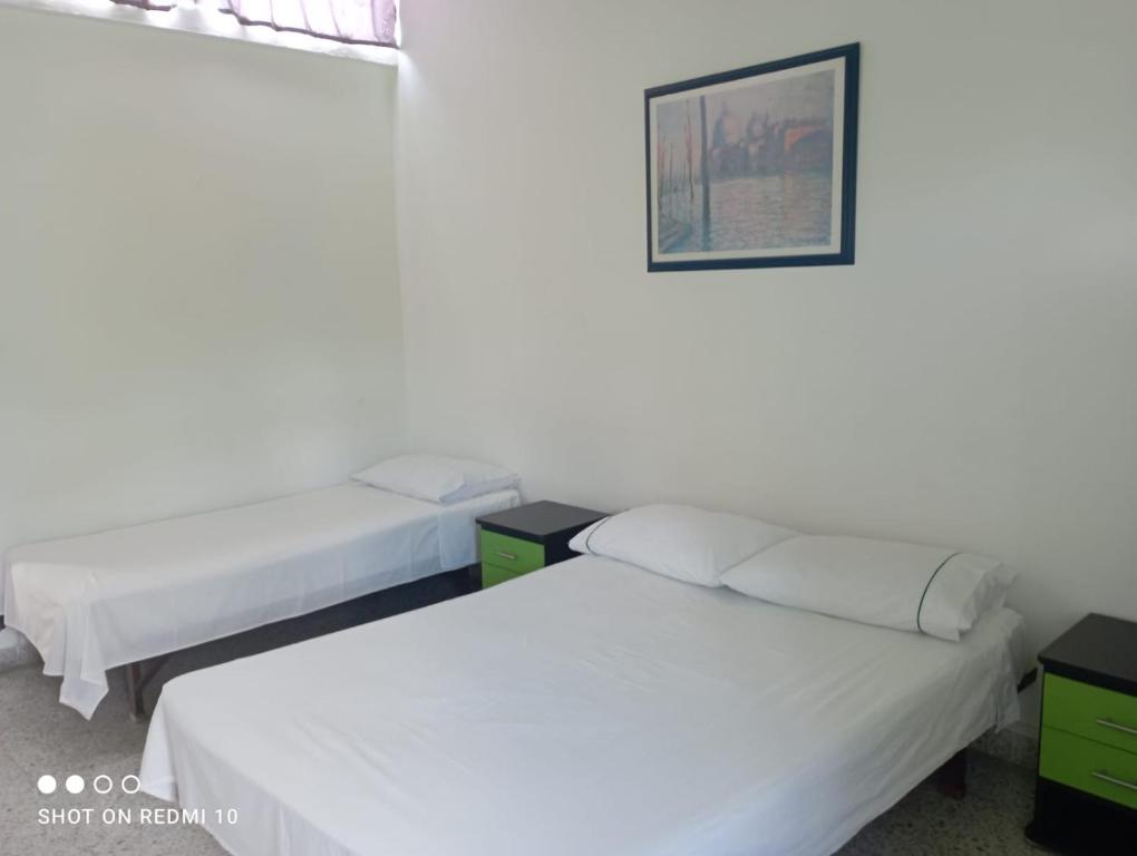 Postel nebo postele na pokoji v ubytování Hotel Albatros