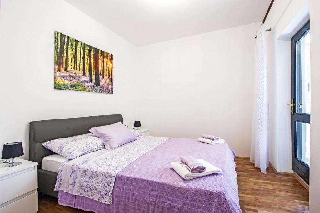 Postel nebo postele na pokoji v ubytování Apartment Andrejka