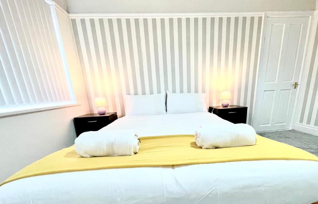 Ένα ή περισσότερα κρεβάτια σε δωμάτιο στο Lotus Home Wallasey