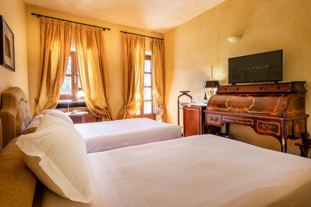 Letto o letti in una camera di Hotel Casa Pavesi
