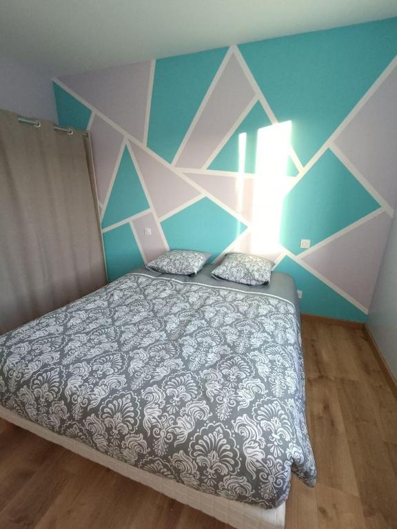 Posteľ alebo postele v izbe v ubytovaní Le Petit Gîte du Mont