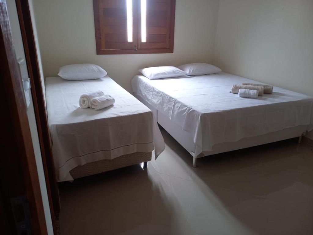 Ένα ή περισσότερα κρεβάτια σε δωμάτιο στο Hospedaria São João