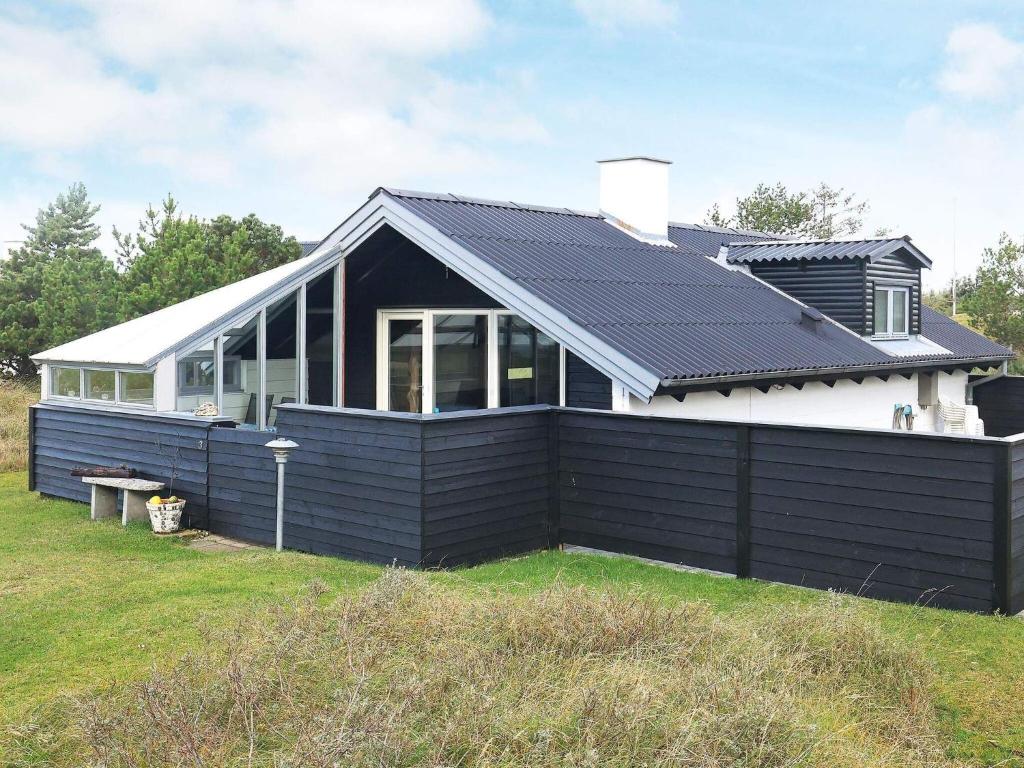 a house with solar panels on the roof at Holiday home Thisted XLIX in Thisted