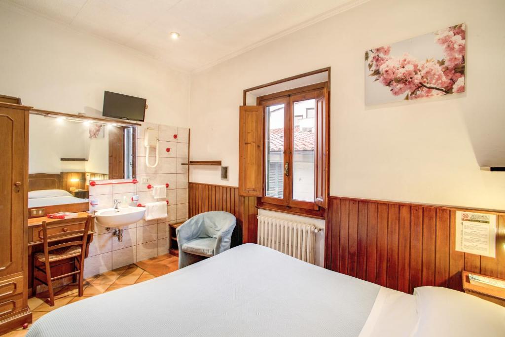 Postel nebo postele na pokoji v ubytování Hotel Lorena