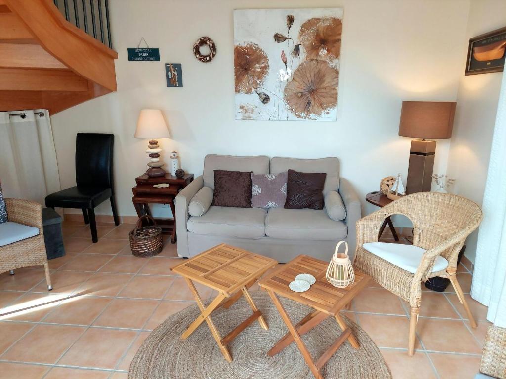a living room with a couch and a table at Holiday home with sea views, Plounéour-Brignogan-Plages in Plounéour-Trez