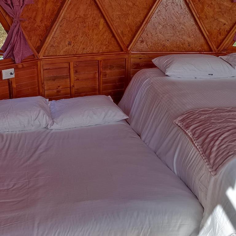 Postel nebo postele na pokoji v ubytování Domos lago Muisca Xue