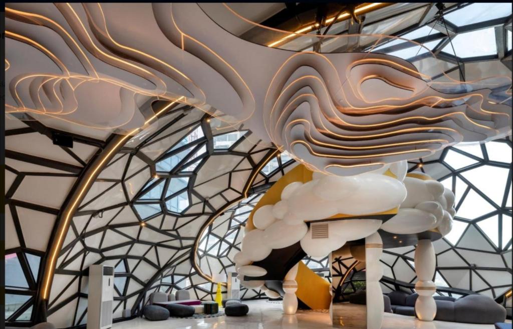 a sculpture of a cloud hanging from a ceiling at ARTE plus Jalan Ampang - KLCC in Kuala Lumpur