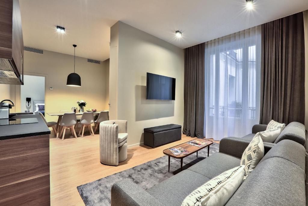 a living room with a couch and a table at 140 - Urban Duplex near Saint-Germain des Pres in Paris