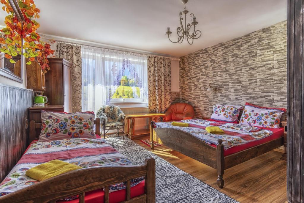 Postel nebo postele na pokoji v ubytování Penzion Šilon