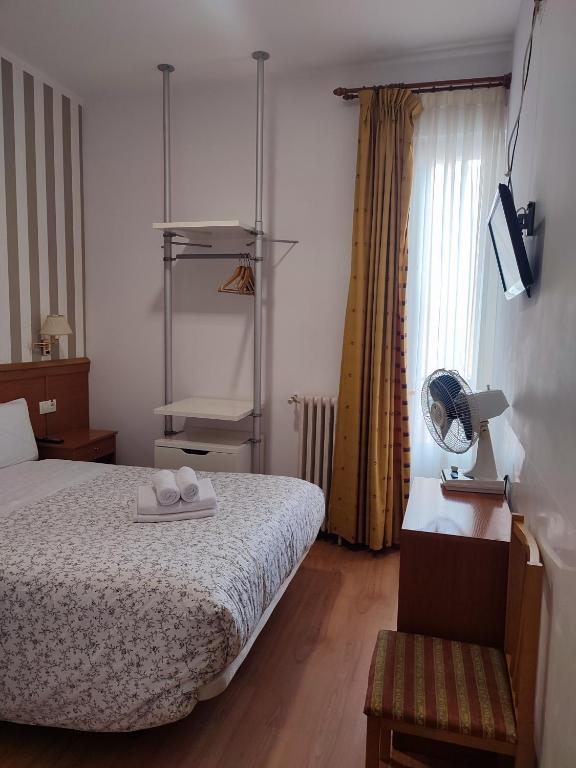 Postel nebo postele na pokoji v ubytování Hostal Salomé