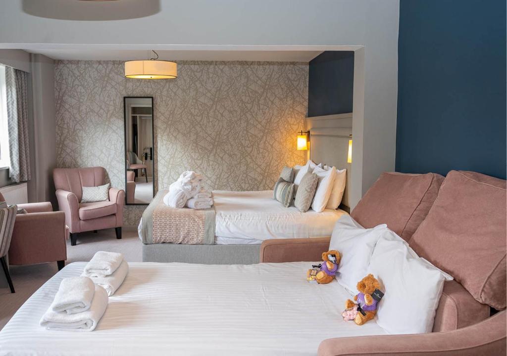 Postel nebo postele na pokoji v ubytování Gretna Hall Hotel