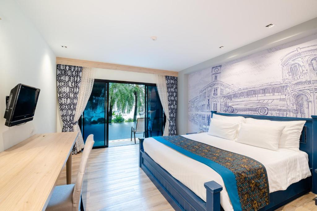 Postel nebo postele na pokoji v ubytování Bhukitta Boutique Hotel Phuket Town