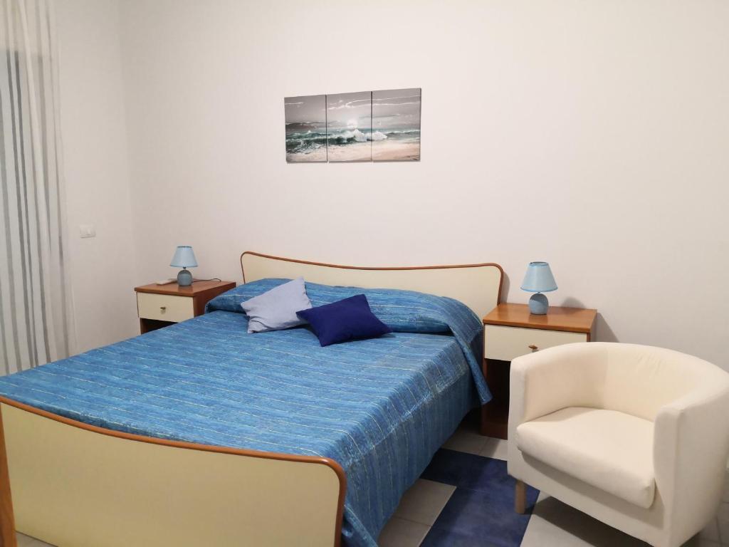 Postel nebo postele na pokoji v ubytování Luna's House Fondachello