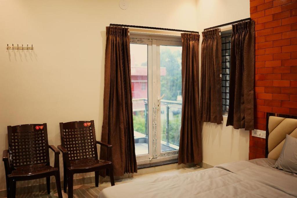 Postel nebo postele na pokoji v ubytování Melody Inn Luxury Home Stay