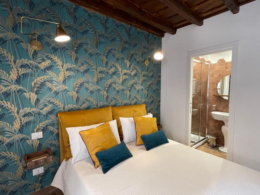 Säng eller sängar i ett rum på Suite La chiostrina al Cedro