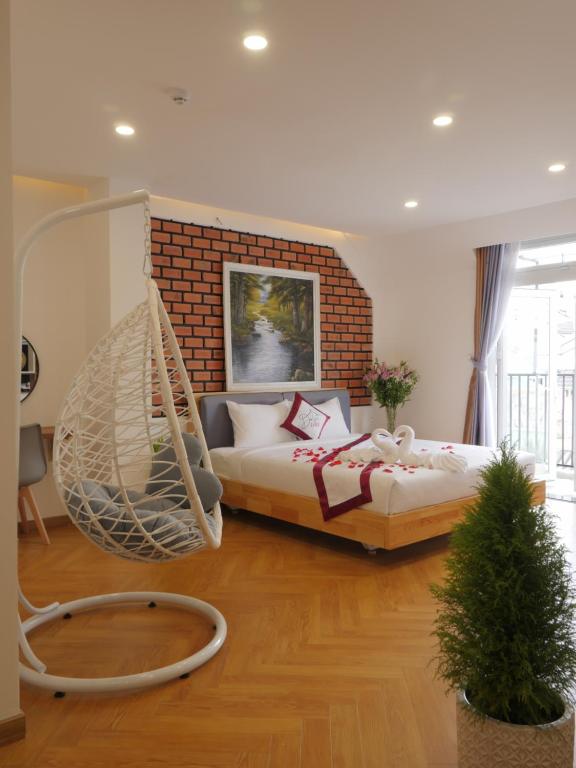 Postel nebo postele na pokoji v ubytování Feliz Dalat Homestay