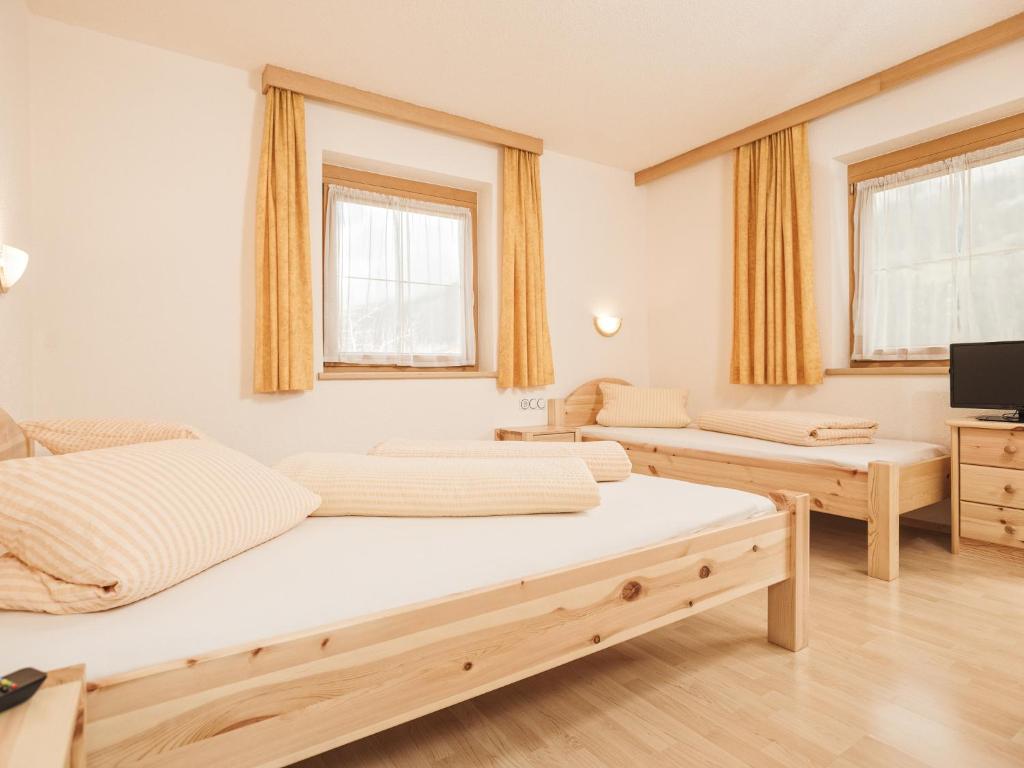 Postel nebo postele na pokoji v ubytování Deluxe Apartment Sonnseite