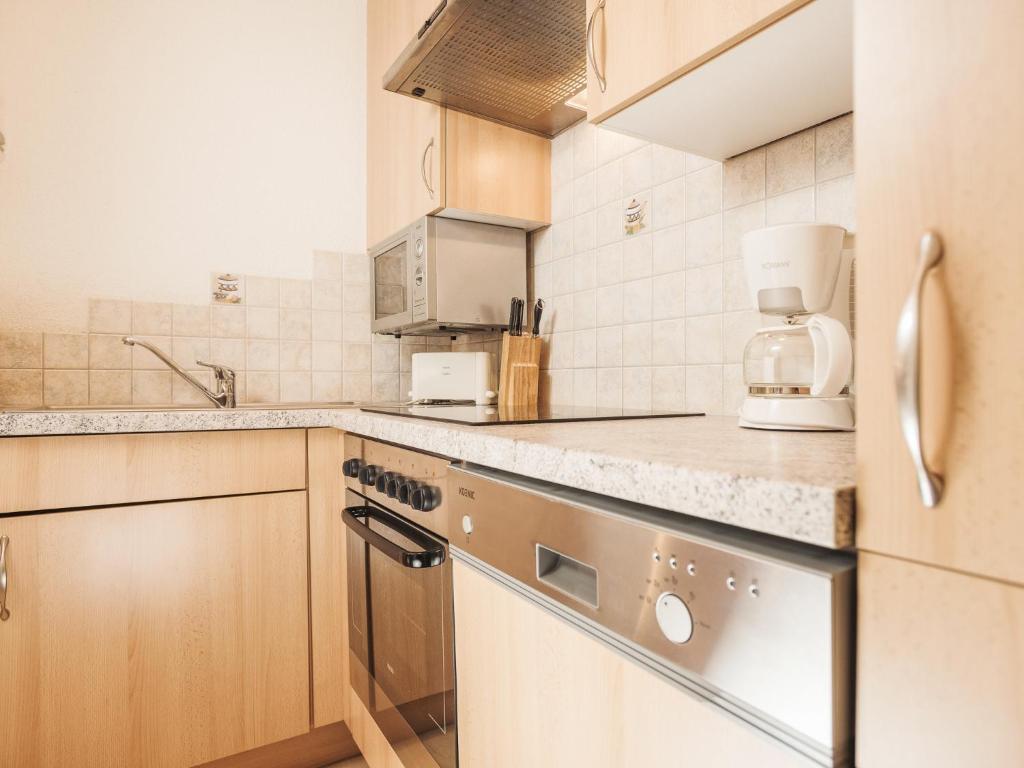 Kuchyň nebo kuchyňský kout v ubytování Deluxe Apartment Sonnseite