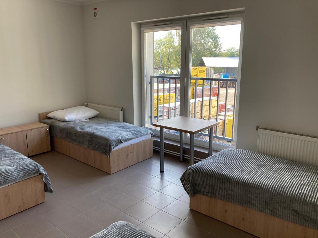 Postel nebo postele na pokoji v ubytování Hostel przy Stadionie