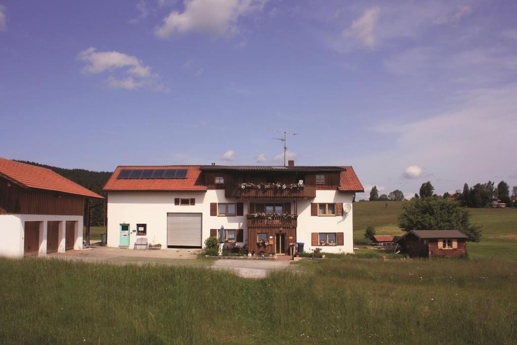 a large white house with a brown roof at Haus Anny in Haidmühle