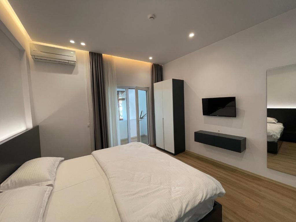 Postel nebo postele na pokoji v ubytování Ladi Rooms