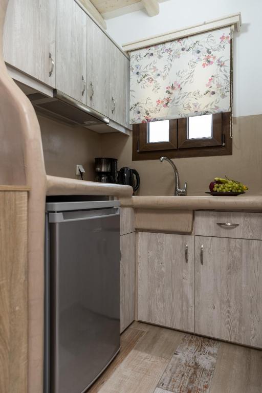 a kitchen with a sink and a dishwasher at Elizabeth's small apartment in Naxos Chora