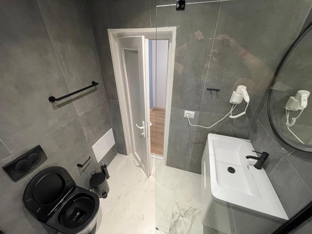 Koupelna v ubytování Ladi Rooms