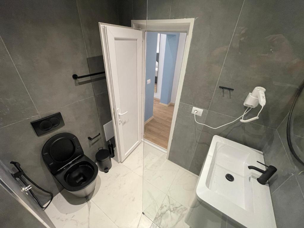 Koupelna v ubytování Ladi Rooms