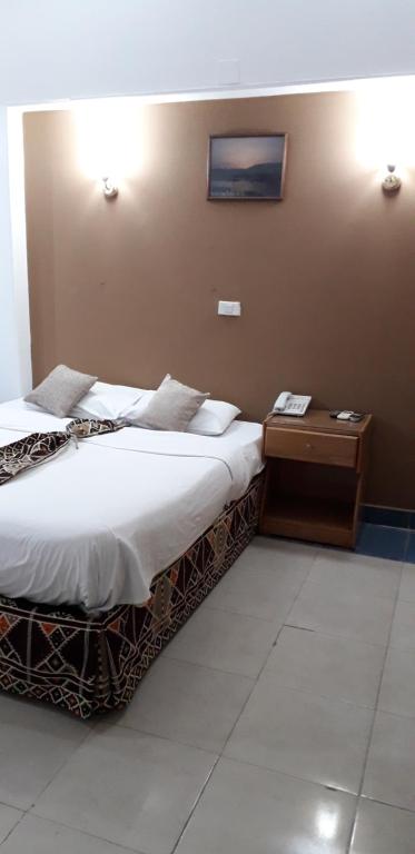 Postel nebo postele na pokoji v ubytování Marhaba Palace Hotel