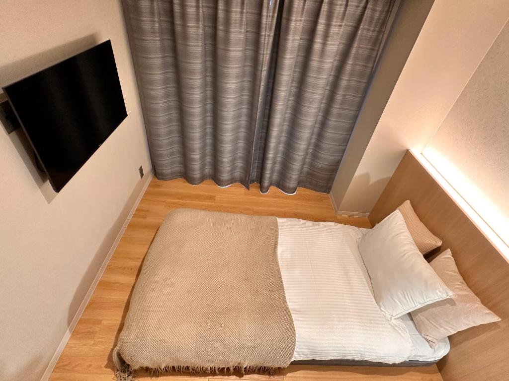 Postel nebo postele na pokoji v ubytování R Hotel Namba