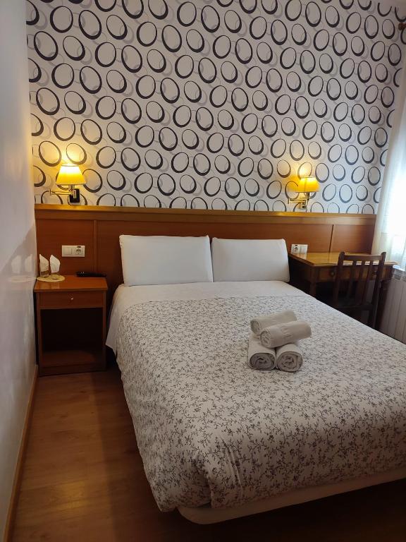 Postel nebo postele na pokoji v ubytování Hostal Salomé