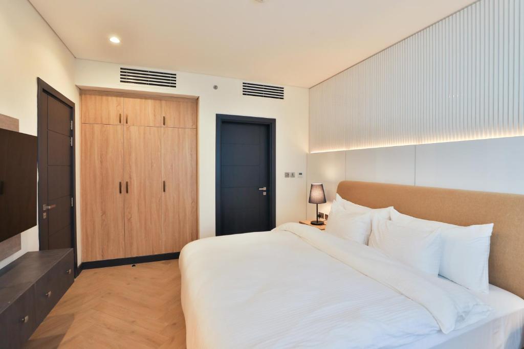 Postel nebo postele na pokoji v ubytování Royal Mansoura Residence Hotel